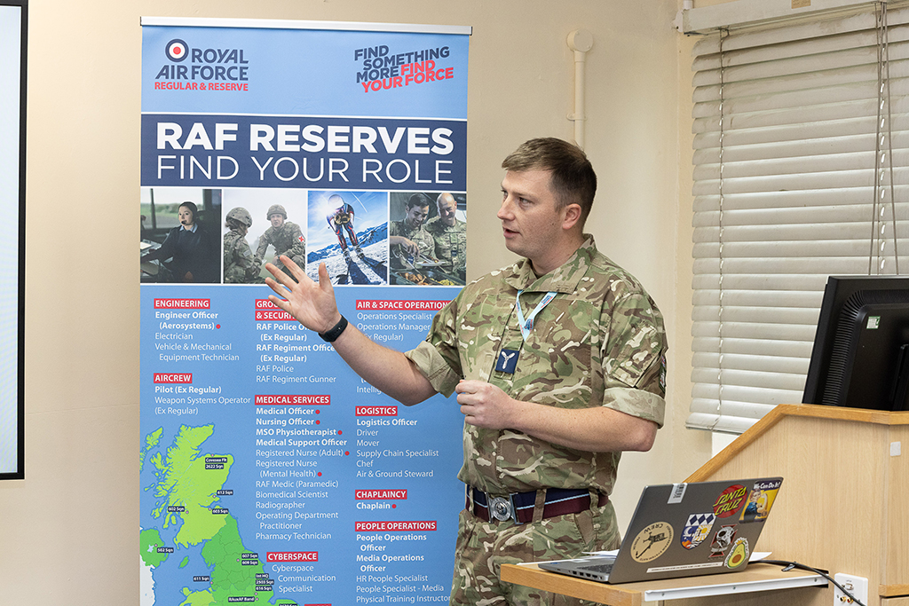 An Air Specialist delivers a Safety Week brief to the gathered audience